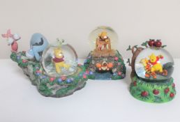 Three Disney snow globes : Winnie the Pooh and Friends