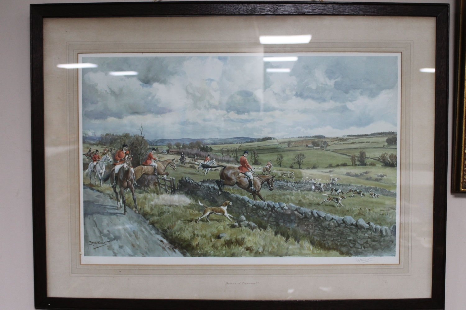 An early 20th century oak framed signed hunting print,