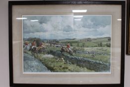 An early 20th century oak framed signed hunting print,