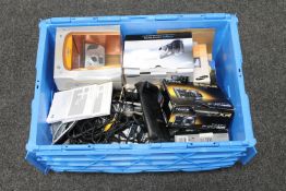 A crate of digital cameras and leads
