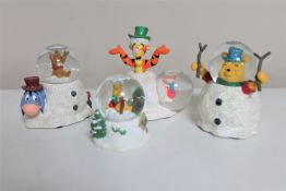 Four Disney snow globes : Winnie the Pooh and Friends