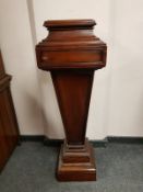 A Victorian style mahogany pedestal, height 115 cm.