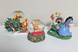 Three Disney snow globes : Winnie the Pooh and Friends