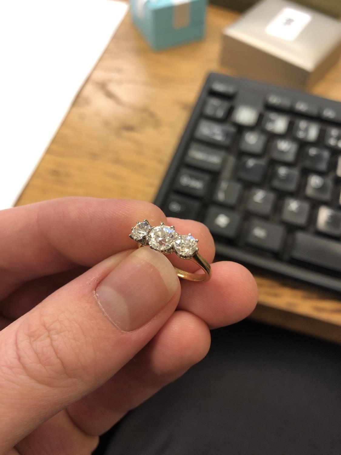 An 18ct gold three-stone diamond ring, - Image 4 of 6