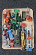 A tray containing mid 20th century and later die cast vehicles including farming equipment, tanks,