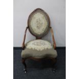 A late 19th century mahogany spoon back chair in floral tapestry