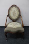 A late 19th century mahogany spoon back chair in floral tapestry