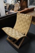 A late 20th century folding chair in hessian webbing