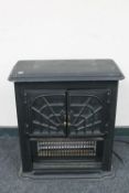 A Dimplex electric fire in the form of a stove