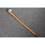 An unusual nineteenth century malacca walking cane with green glass knop terminal modelled as a