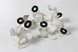 Six miniature cast iron Michelin Men figures