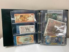 An album of World bank notes including a sealed wrap of 5,000 Iraq Dinar etc.