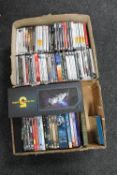 A box of Babylon 5 box sets and assorted DVDs and a box of PC games