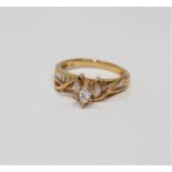 A 14ct gold marquise and baguette-cut diamond ring, size K.
