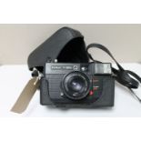 A Konica C35 EFP camera in case with 38mm lens