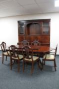 An eight piece inlaid mahogany Strongbow dining room suite comprising of cocktail display cabinet,