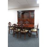An eight piece inlaid mahogany Strongbow dining room suite comprising of cocktail display cabinet,