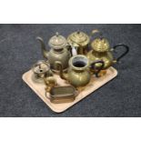 A tray of brass coffee and teapots,