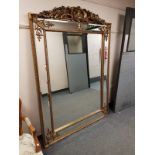 An ornate gilt framed Regency style mirror,