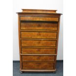 An antique continental walnut seven drawer chest