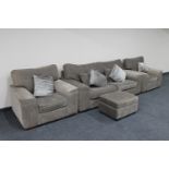 A three piece lounge suite with matching footstool and six scatter cushions