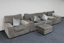 A three piece lounge suite with matching footstool and six scatter cushions