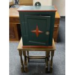 A nest of two oak tables together with a painted wall cabinet