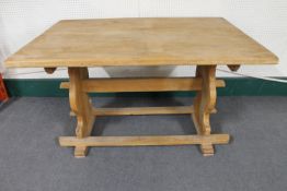 A blond oak refectory dining table