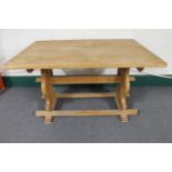 A blond oak refectory dining table