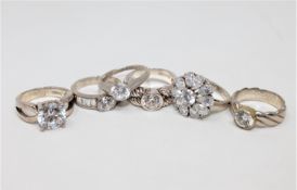 Six silver dress rings