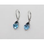 A pair of 10ct white gold blue topaz and diamond drop earrings,