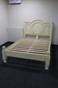 A contemporary cream painted 4'6 bed frame
