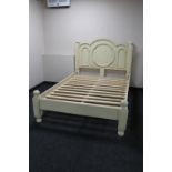 A contemporary cream painted 4'6 bed frame