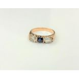 An antique 18ct gold sapphire and diamond three stone ring,