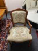 A stained beech framed continental salon chair upholstered in a tapestry fabric