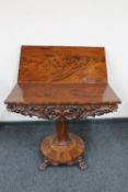 A Wiliiam IV mahogany pedestal turn over top tea table on paw feet CONDITION REPORT: