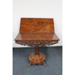 A Wiliiam IV mahogany pedestal turn over top tea table on paw feet CONDITION REPORT: