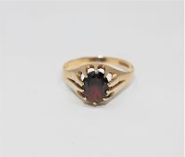 A 9ct gold garnet set ring, size V CONDITION REPORT: 2.