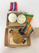 Two WW II Defence medals together with a WW I medal 776394 BMBR A.Hall R.A.
