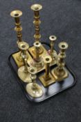 A tray of brass candlesticks,