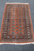 A Bokhara rug on red ground,