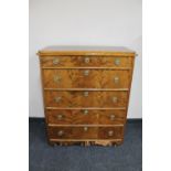 An antique continental birch and pine five drawer chest