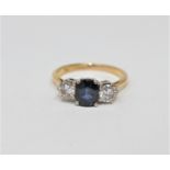 An 18ct gold sapphire and diamond three stone ring,