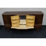 A mid twentieth century walnut Beautility cocktail sideboard