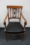 An antique inlaid mahogany scroll arm armchair