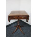 A mahogany flap sided occasional table