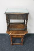 A mid 20th century oak sewing table and an oak side table