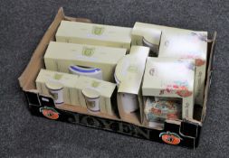 A box of Ringtons china : 100 year celebration caddies, teapots,