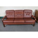 A mid 20th century Danish wood framed brown button leather settee