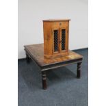 A sheesham wood rectangular coffee table with metal mounts together with a double door corner